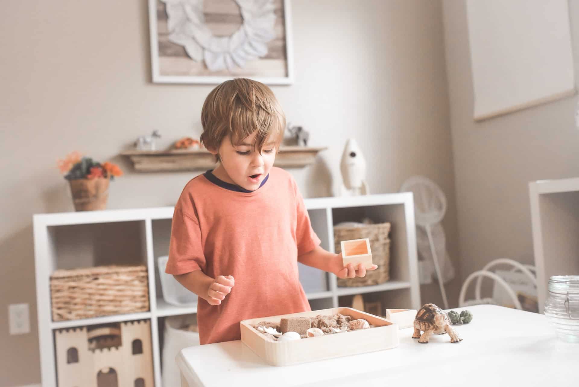 boy playing with sand