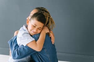 What is emotional regulation? Mom Hugging Son